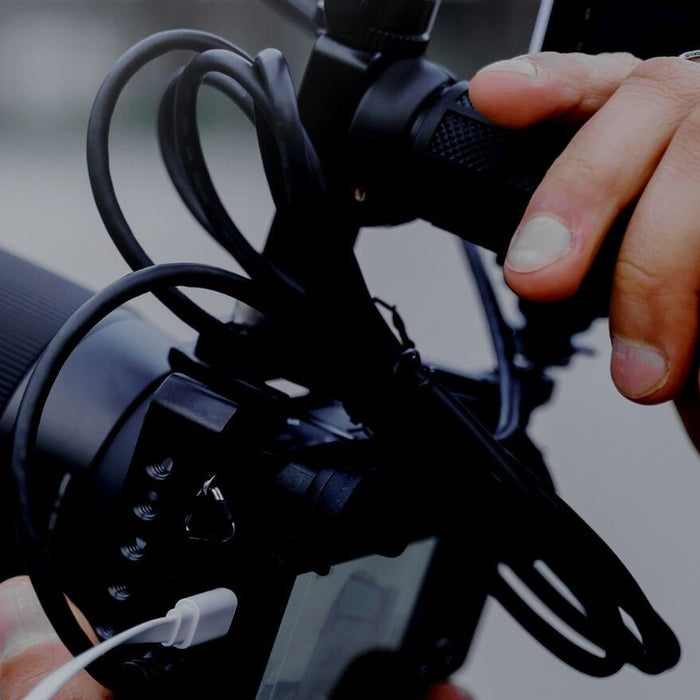 Best Camera Hand Grips Hero - Image of a Filmmaker Using a Hand Grip to Add Stability to His Shots