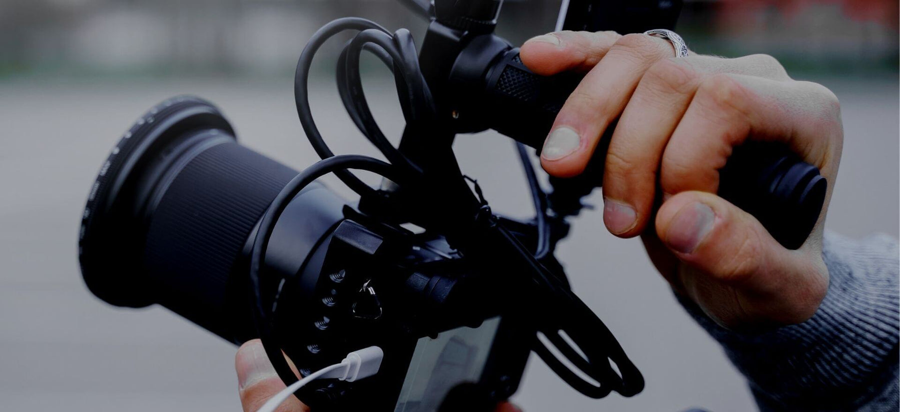 Best Camera Hand Grips Hero - Image of a Filmmaker Using a Hand Grip to Add Stability to His Shots